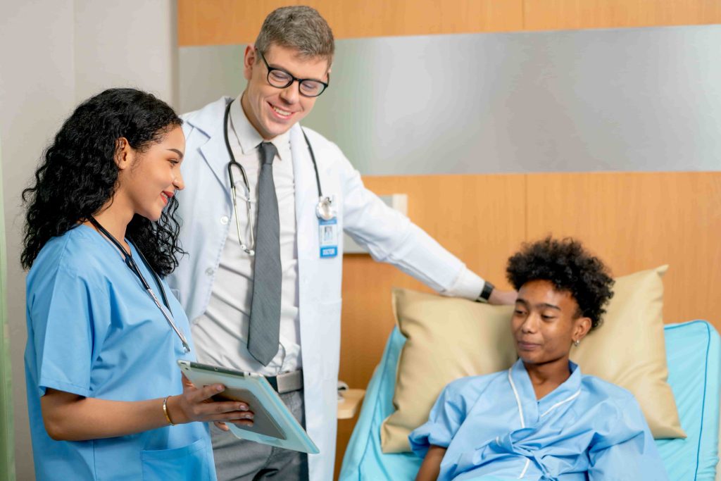 nurse and doctor talking to patient